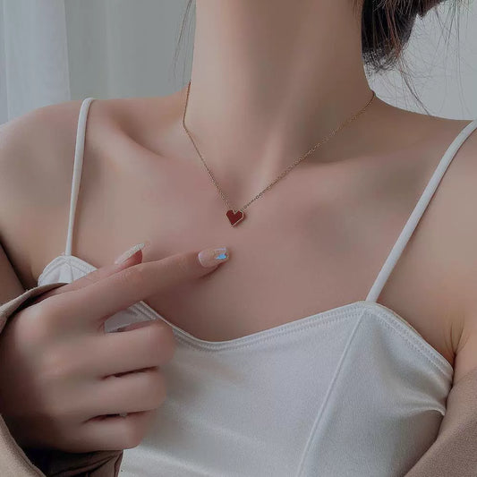 Model Wearing Red heart pendant necklace – French vintage design in gold plating by STUD-Shop Till You Drop