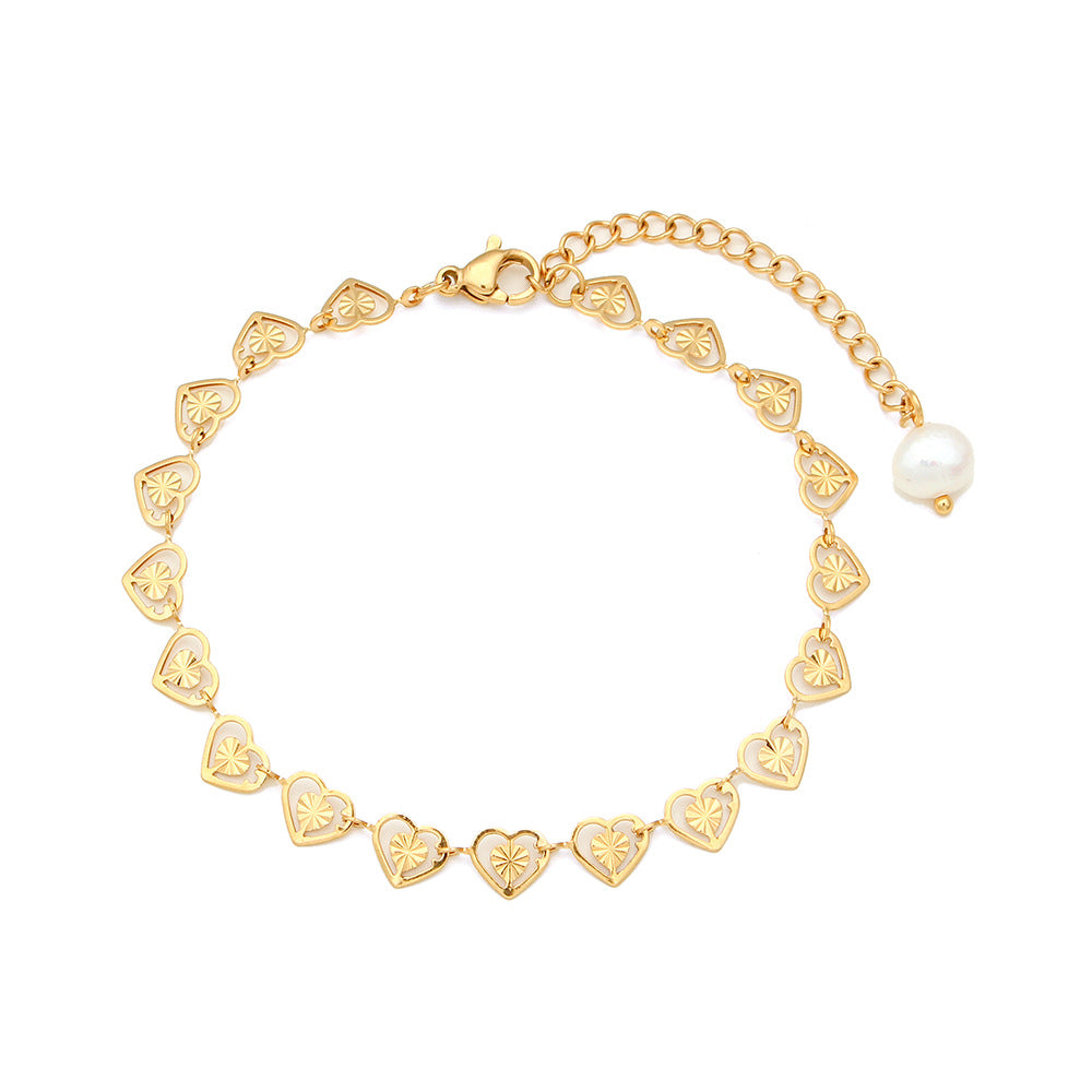 Close View of Heart bracelet with pearl accent – electroplated stainless steel design by STUD-Shop Till You Drop