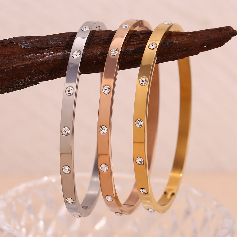 Silver stainless steel zircon bangle with round stones and snap-lock clasp – STUD