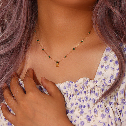 Model wearing Green bead and shell pendant necklace – waterproof titanium steel by STUD-Shop Till You Drop