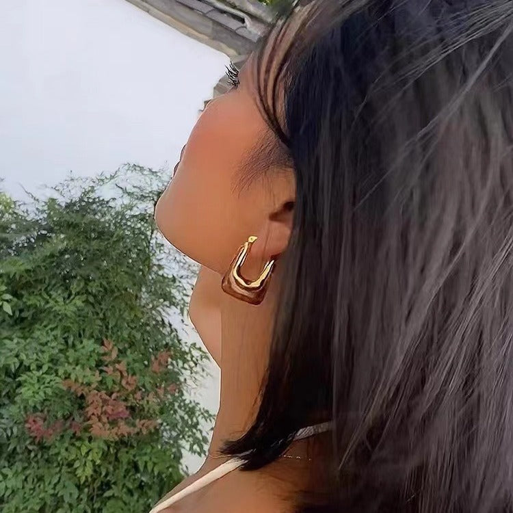 Model Wearing Brown geometric hoop earrings – lightweight, vintage-inspired design by STUD (Shop Till You Drop)