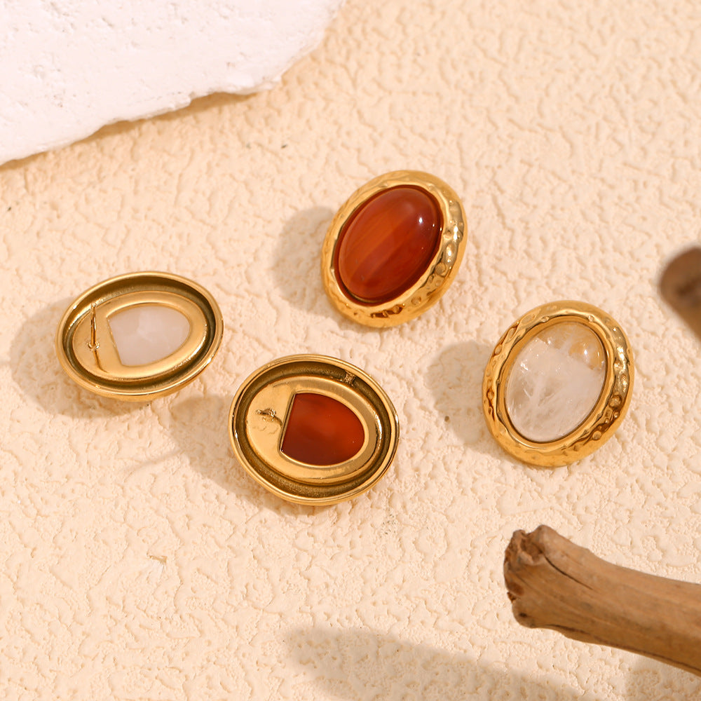 Top View of Vintage-inspired gold oval earrings with hammered finish and maroon stone – 18K gold-plated, waterproof by STUD (Shop Till You Drop)