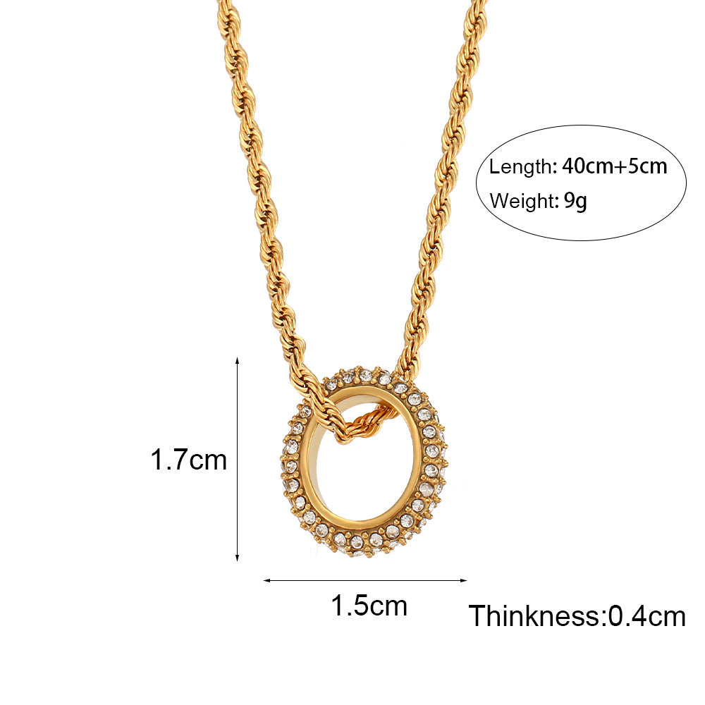 Twisted gold rope chain necklace with zircon circle pendant on display