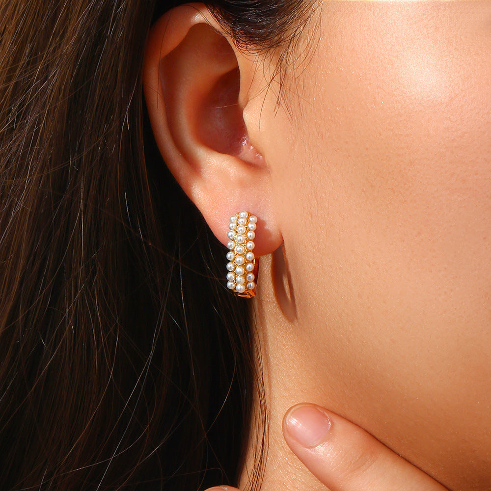 Model Wearing Baroque pearl hoop earrings – minimalist 18K gold-plated, waterproof, hypoallergenic by STUD (Shop Till You Drop)