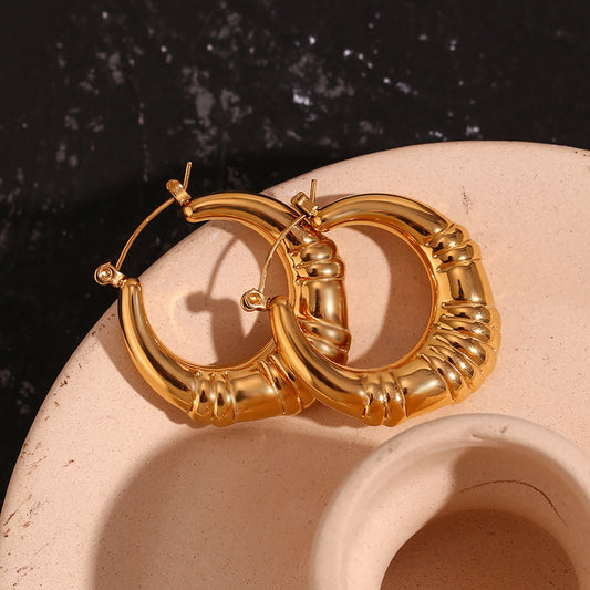 Top View of Vintage-inspired gold hoop earrings – 18K gold-plated triple-stripe, waterproof by STUD (Shop Till You Drop)