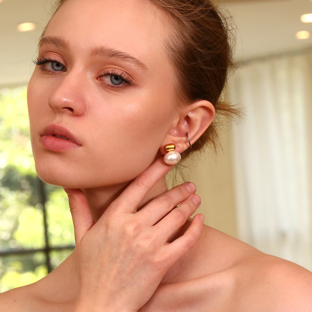 Model Wearing Elegant gold-plated pearl stud earrings – minimalist, waterproof, hypoallergenic by STUD (Shop Till You Drop)