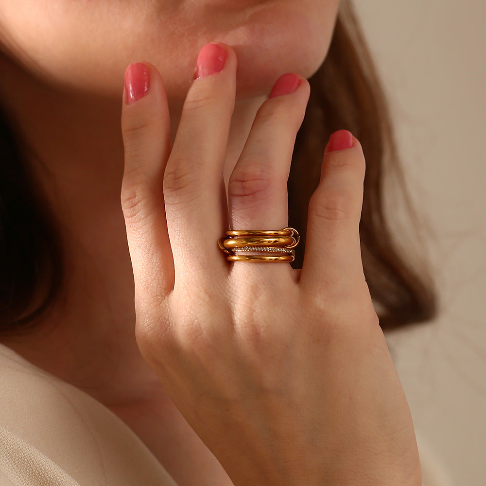 18K gold plated layered statement ring with 4 interlocked bands and zircon detailing – STUD