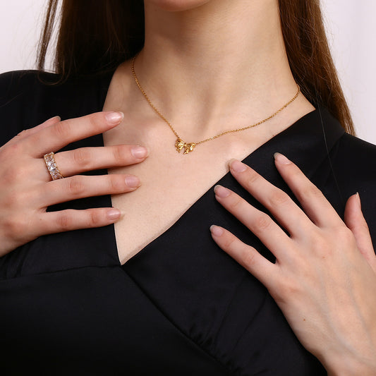 Gold bow pendant necklace - 18K gold plated, waterproof and hypoallergenic by STUD