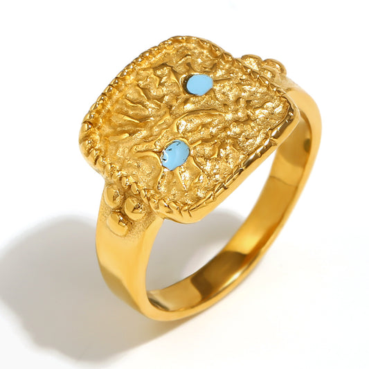 Close up view of
Celestial sun and star ring – 18K gold-plated stainless steel with enamel and hammered texture – cosmic statement jewelry by STUD (Shop Till You Drop)