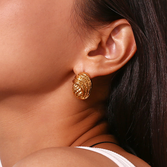 Model Wearing Vintage geometric hammered earrings – 18K gold-plated, hollow design, waterproof by STUD (Shop Till You Drop)