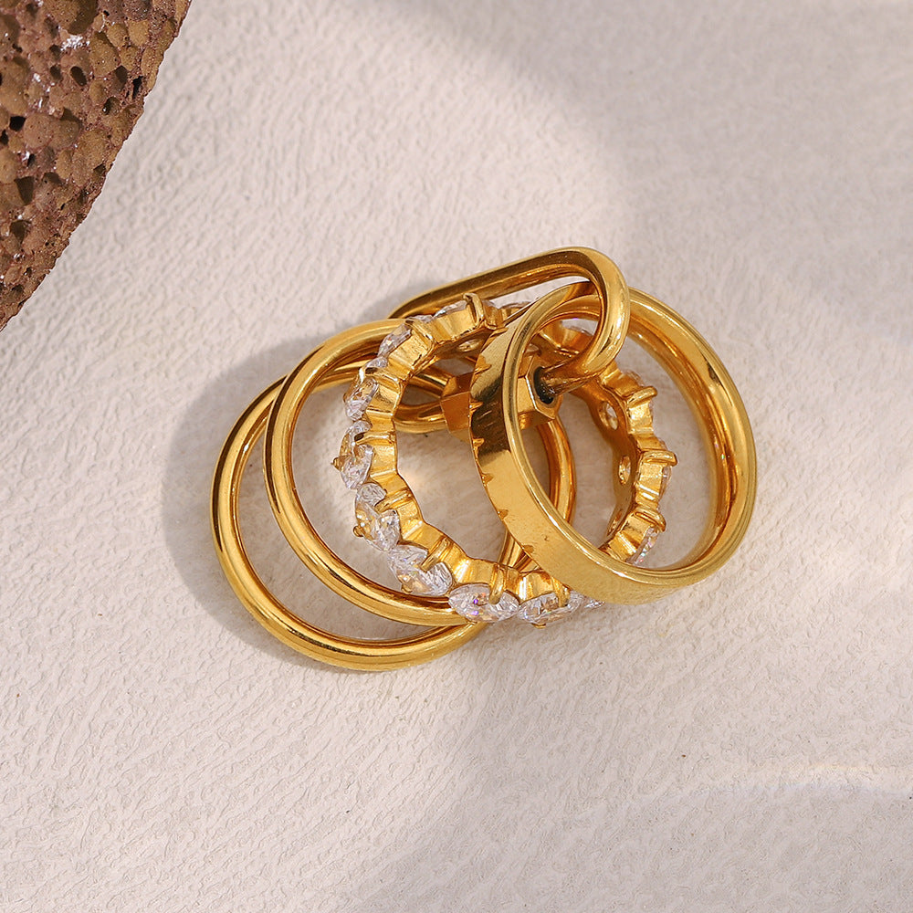 18K gold plated stacked ring set with high-shine bands and white zircon centerpiece – STUD