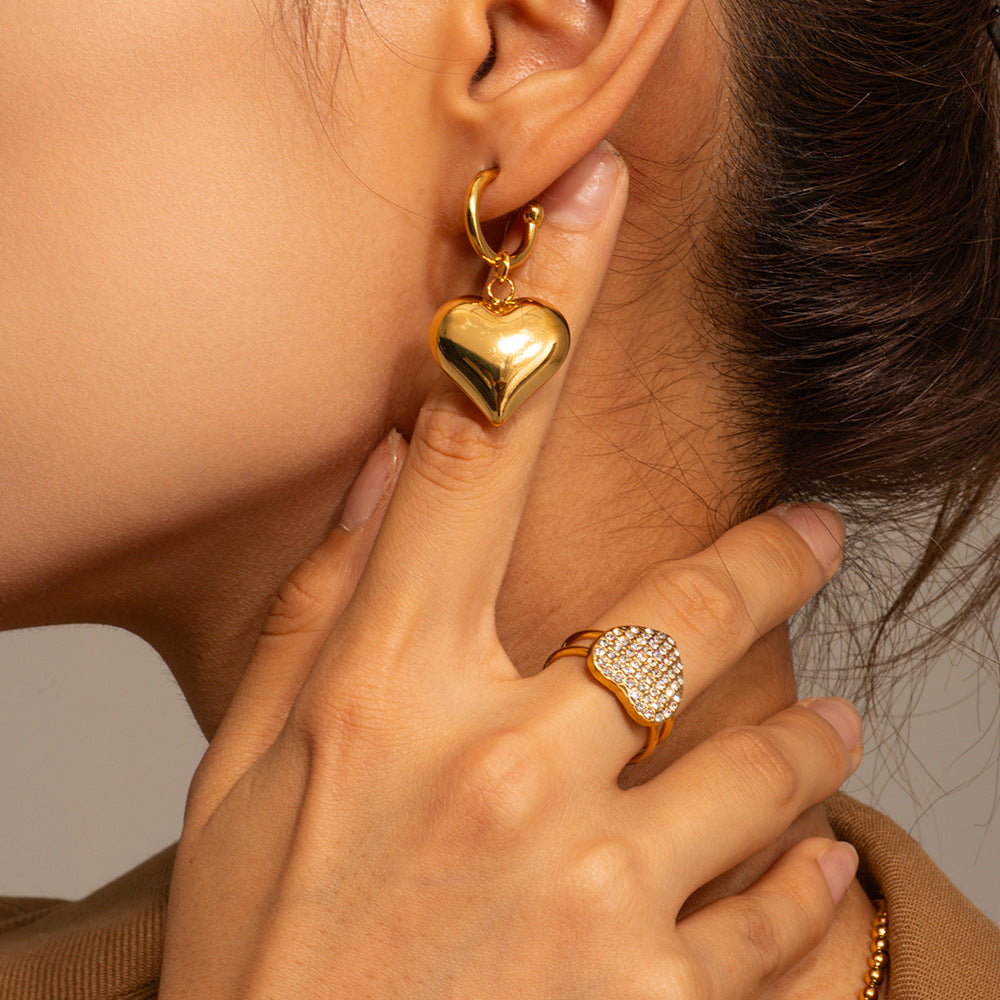 Model Wearing Vintage gold heart-shaped hoop earrings – 18K gold-plated, waterproof, hypoallergenic by STUD (Shop Till You Drop)