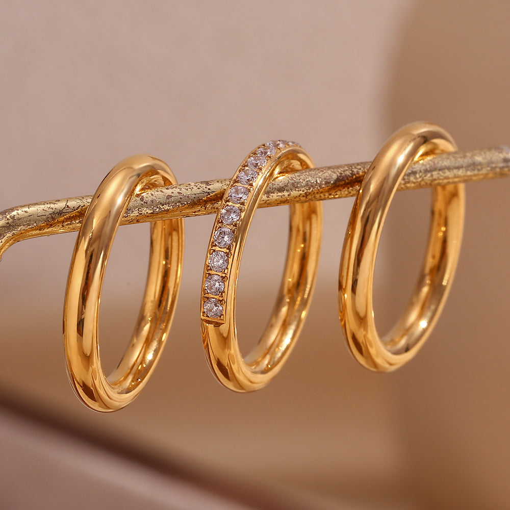 close up view of Minimalist gold zircon ring set – 3-piece 18K gold-plated stainless steel bands with stackable sparkle – by STUD (Shop Till You Drop)