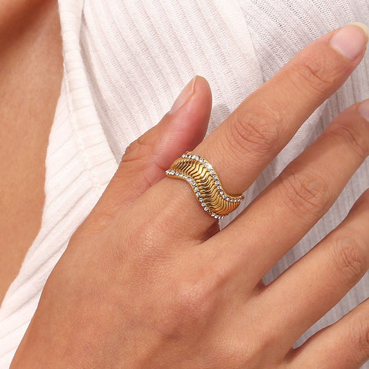 Model wearing Geometric wave ring with crystals – 18K gold-plated stainless steel bold statement design – luxury jewelry by STUD (Shop Till You Drop)