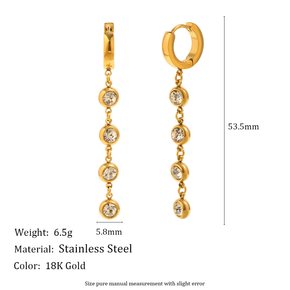 Gold-plated zircon tassel earrings by STUD – minimalist luxury with five sparkling zircon stones on each earring