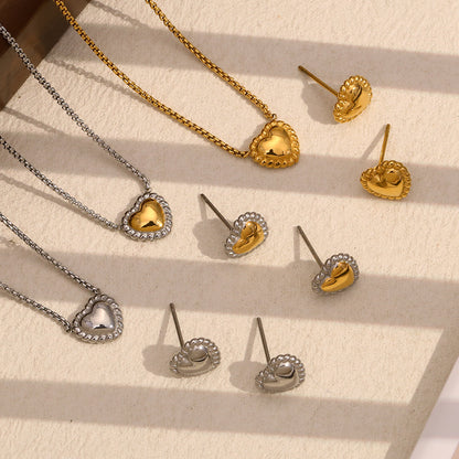 Twisted Gold Heart Necklace styled for layering