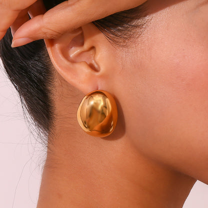 Model Wearing Hollow gold teardrop bead earrings – 18K gold-plated, 3D sculptural design, waterproof by STUD (Shop Till You Drop)