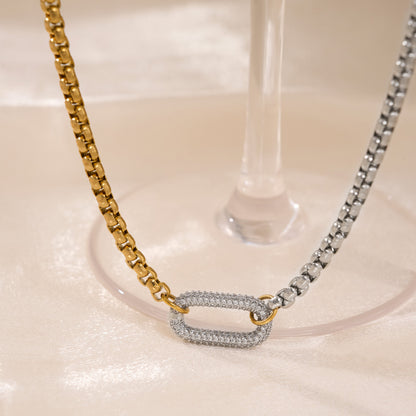 Close view of silver two-tone pendant necklace