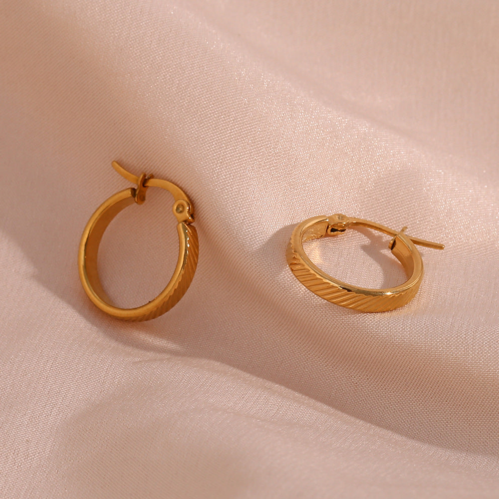 STUD 18K gold-plated slanted textured hoop earrings