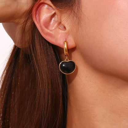 Model Wearing Black onyx heart earrings – 18K gold-plated, waterproof, hypoallergenic studs by STUD (Shop Till You Drop)