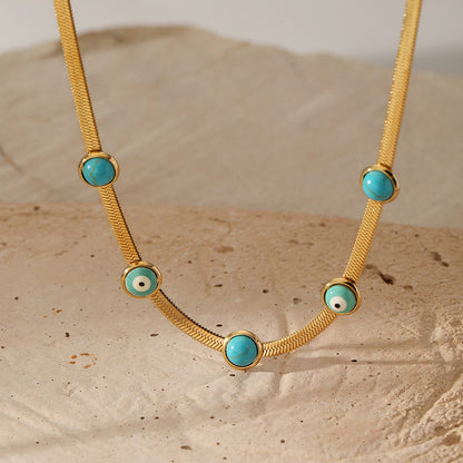 Close view of evil eye turquoise necklace