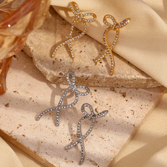 Gold bow stud earrings – 18K gold-plated, twisted design with zircon by STUD (Shop Till You Drop)