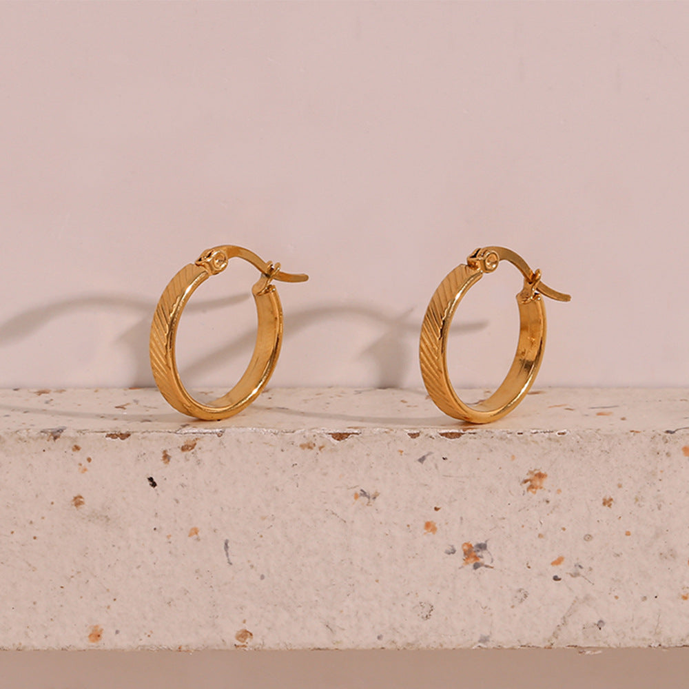 STUD 18K gold-plated slanted textured hoop earrings