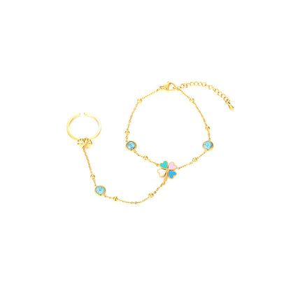 Close View of 18K gold plated hand chain with enamel clover and heart charms – trendy and colorful – STUD