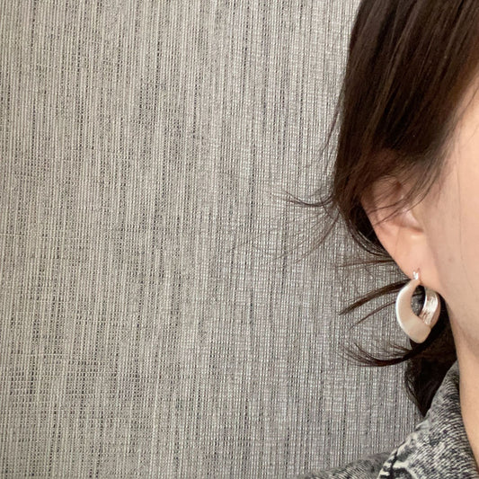 Brushed silver matte hoop earrings with modern irregular shape from STUD