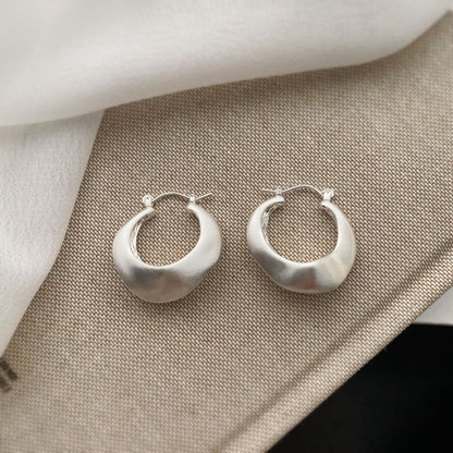 Brushed silver matte hoop earrings with modern irregular shape from STUD