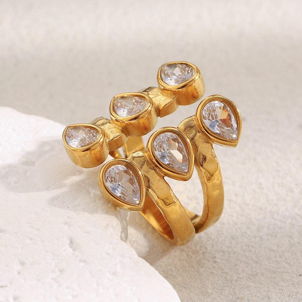 Bold 18K gold-plated open ring with double teardrop zircon stones on hammered stainless steel band – French statement design