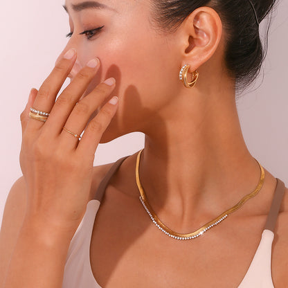 Model Wearing Minimalist fishbone earrings with zircon – 18K gold-plated, geometric, waterproof by STUD (Shop Till You Drop)
