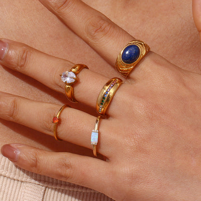 Nature-inspired 18K gold petal ring by STUD