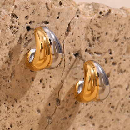Playful curved stud earrings in two tone finish