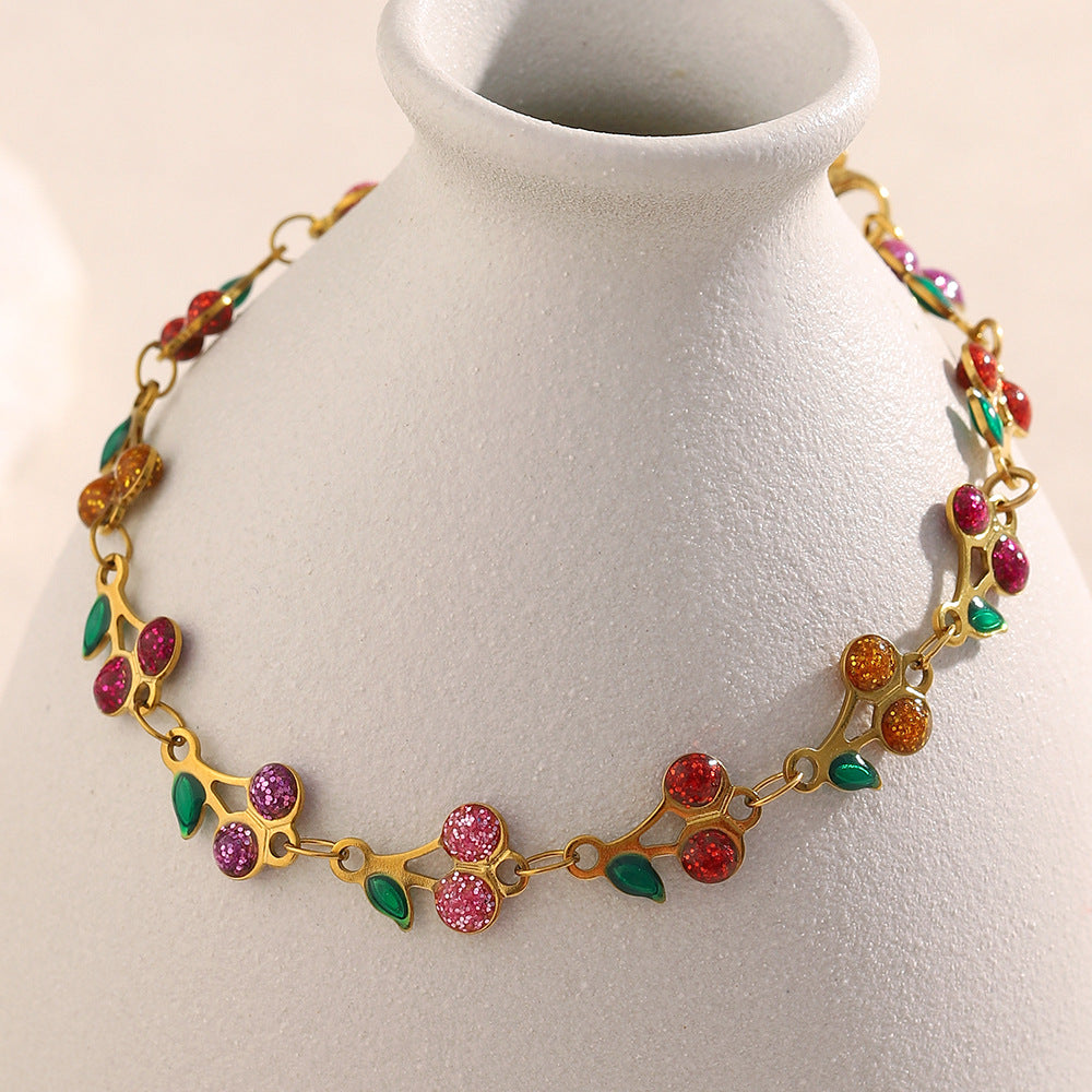 Colorful cherry enamel bracelet with 18K gold finish and leaf details