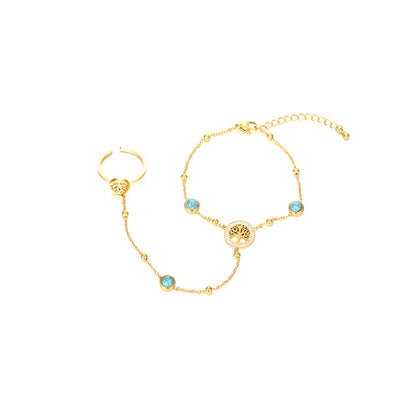 Close View of Tree of Life hand chain bracelet with turquoise charm – gold plated and symbolic – STUD