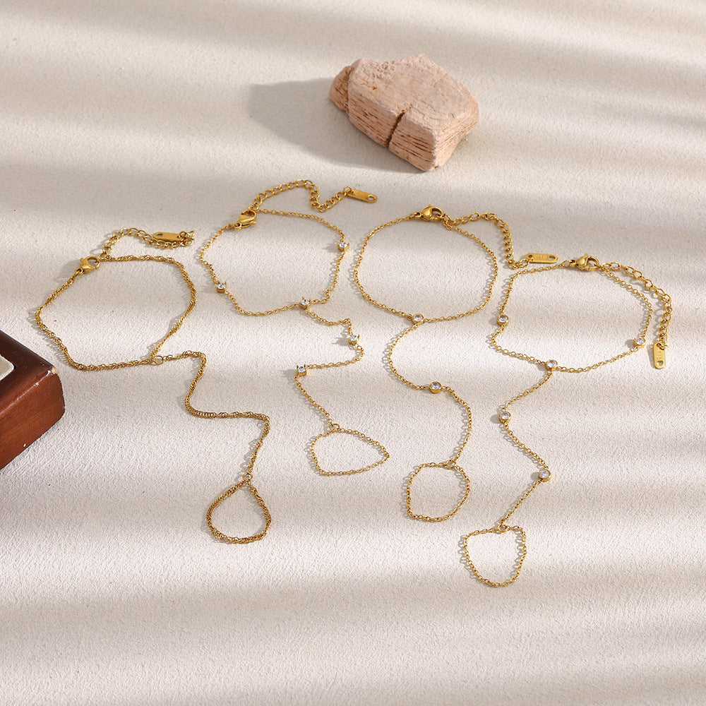 Textured double chain finger bracelet in gold plated stainless steel