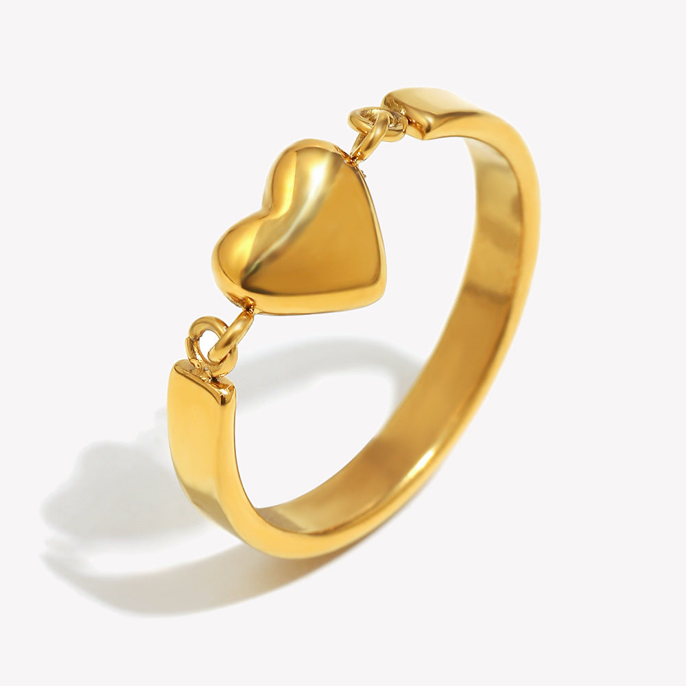 Gold heart ring with minimalist design and 18K gold-plated band
