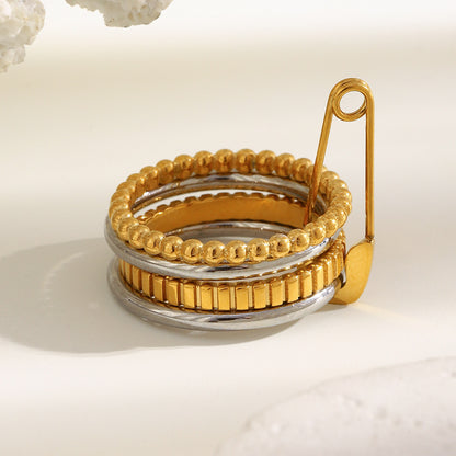 4-layer gold and silver ring with safety pin design, beaded and textured bands