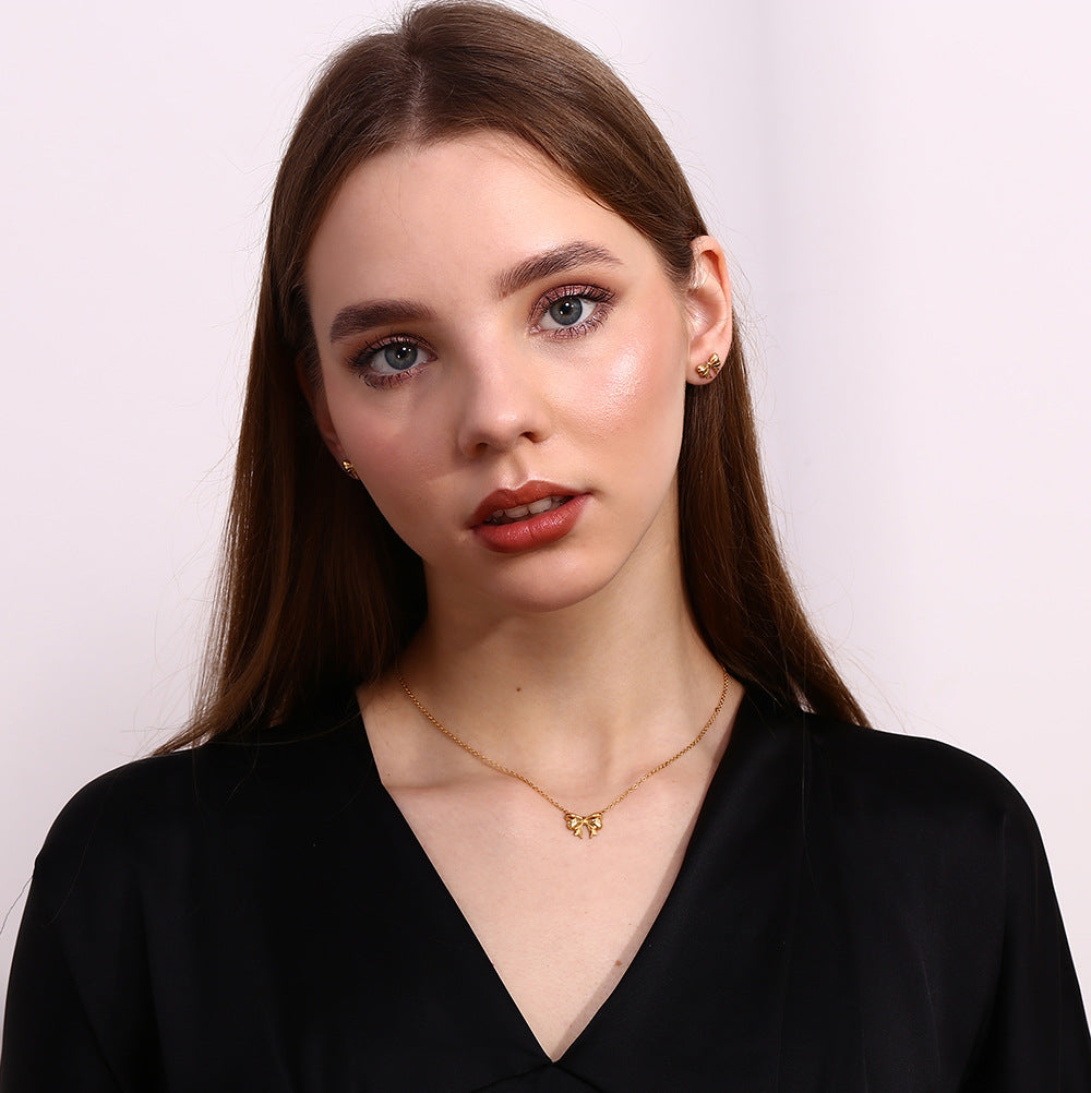 Silver bow stud earrings - Dainty 18K plated silver hypoallergenic earrings by STUD