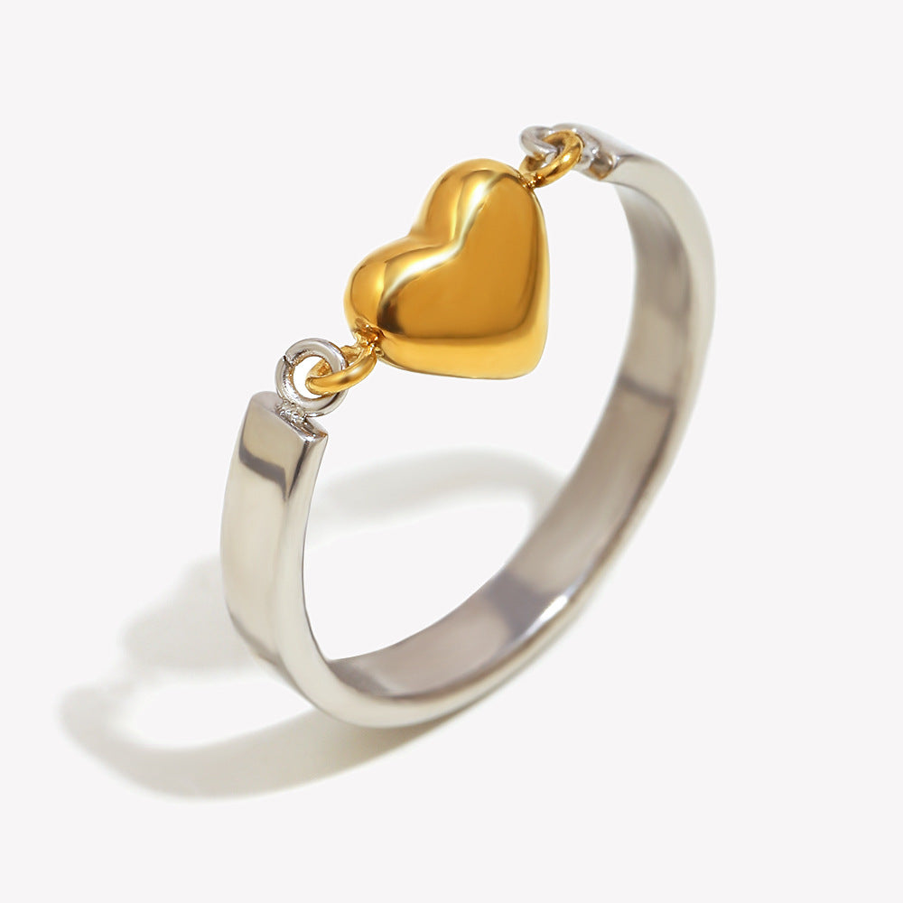 Silver band ring with gold heart detail