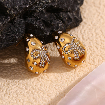 Butterfly bow earrings with teardrop crystals – 18K gold-plated, waterproof, hypoallergenic by STUD (Shop Till You Drop)