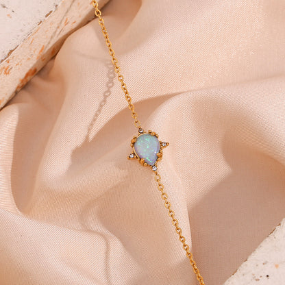 Gold bracelet with blue waterdrop opal charm – vintage design, hypoallergenic by STUD (Shop Till You Drop)