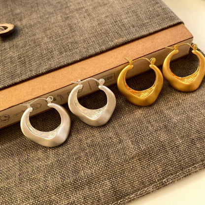 Matte gold handcrafted hoop earrings with irregular modern design by STUD