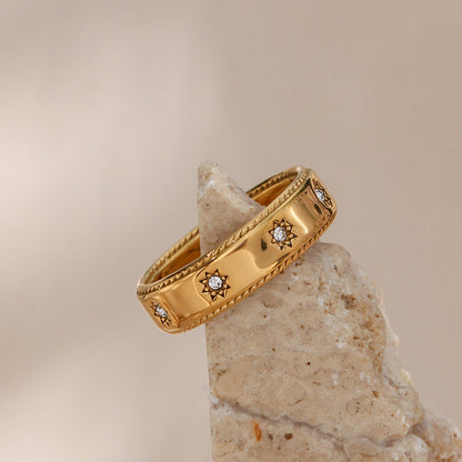 Zircon stones on gold star ring
