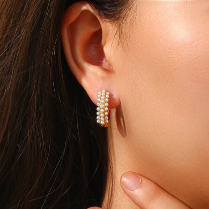 Model Wearing Baroque pearl hoop earrings – minimalist 18K gold-plated, waterproof, hypoallergenic by STUD (Shop Till You Drop)

