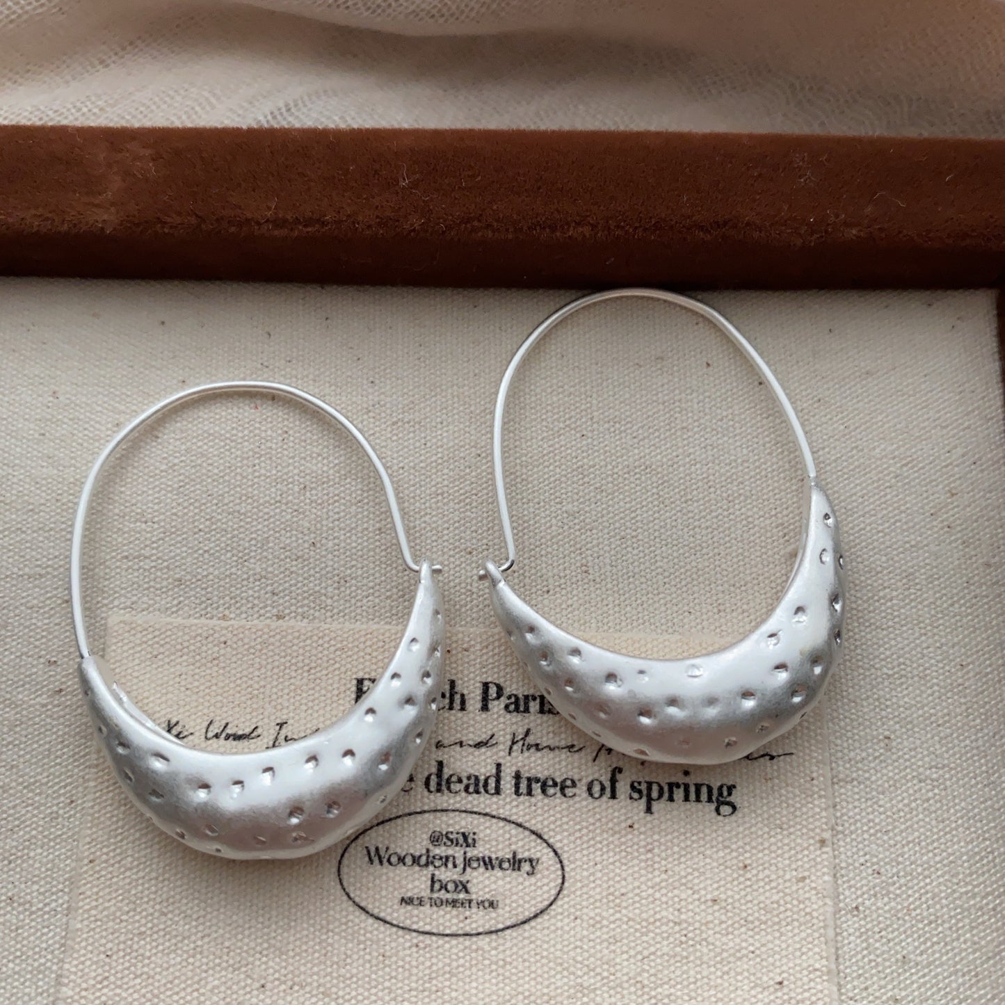 Side view of Minimalist Crescent Hoop Earrings