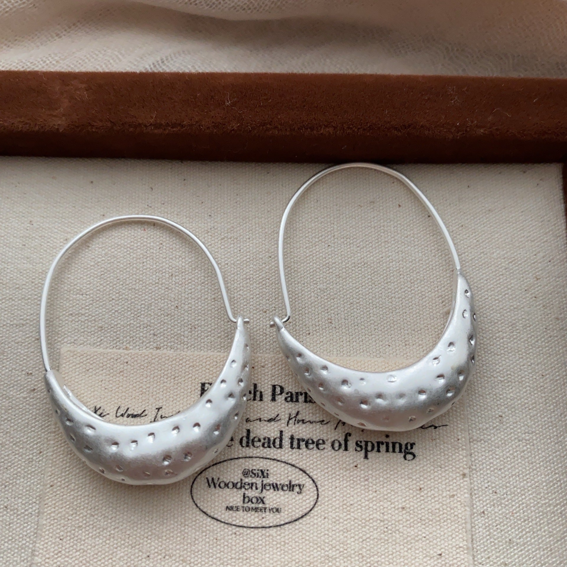 Side view of Minimalist Crescent Hoop Earrings