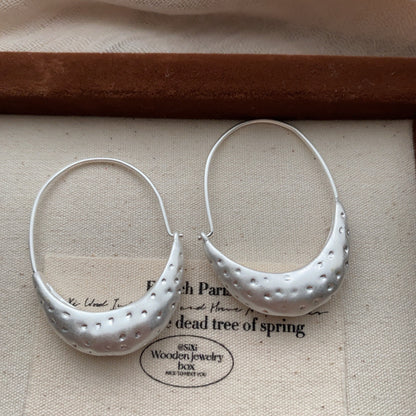 Side view of Minimalist Crescent Hoop Earrings