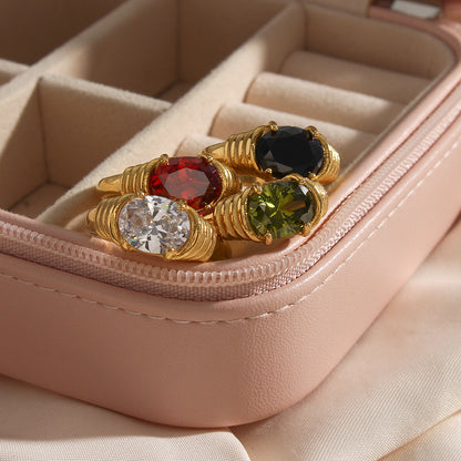 18K gold plated ring with clear oval-cut zircon and textured band – STUD